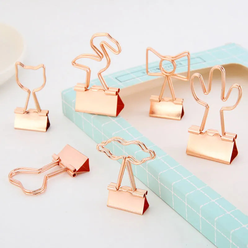 Gold-plated long-tail metal clip with a choice of bow, cactus, cat, flamingo, love, or cloud decorative design.