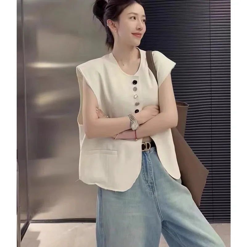 Women's loose-fit polyester vest in milky white with a pocket, shown on a hanger.