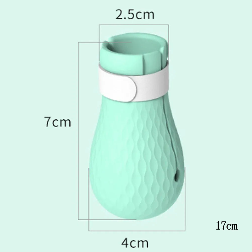 Four green silicone anti-scratch gloves designed to cover a cat's paws.