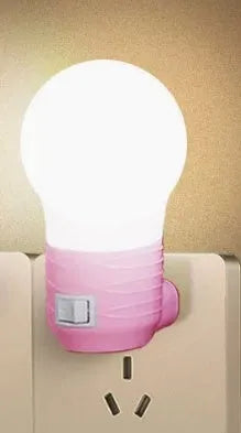 Plug-in bedside baby night light in white, blue or pink with round modern design