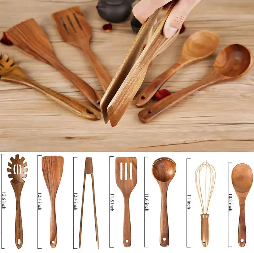 A set of seven wooden cooking utensils including spoons and spatulas on a kitchen counter.