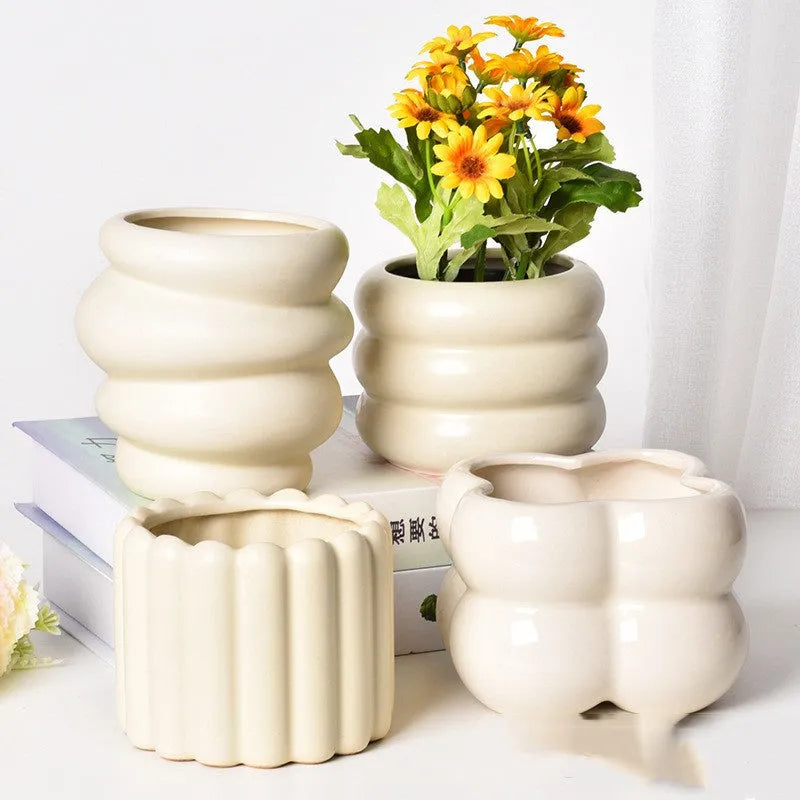 Matte yellow ceramic flower pot with Roman column colour finish for home plant decoration.