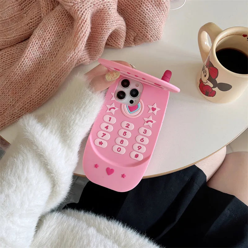 Pink silicone flip phone shaped iPhone case with built-in mirror for models 11 to 15