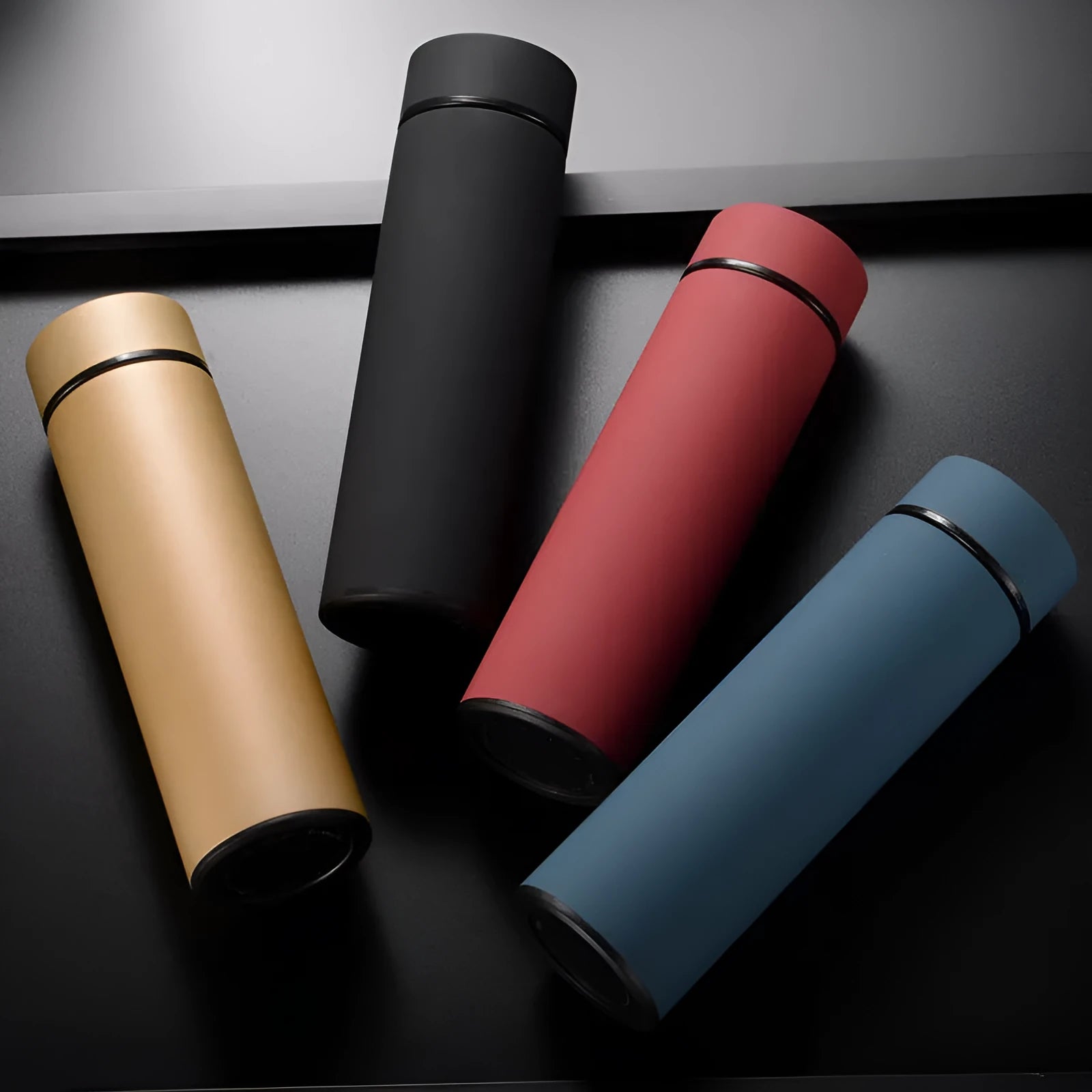 450ml stainless steel vacuum insulated water bottle in choice of colours including black, blue, red, and gold.