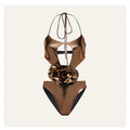 Gold coloured one-piece swimsuit with halter neckline on a model.