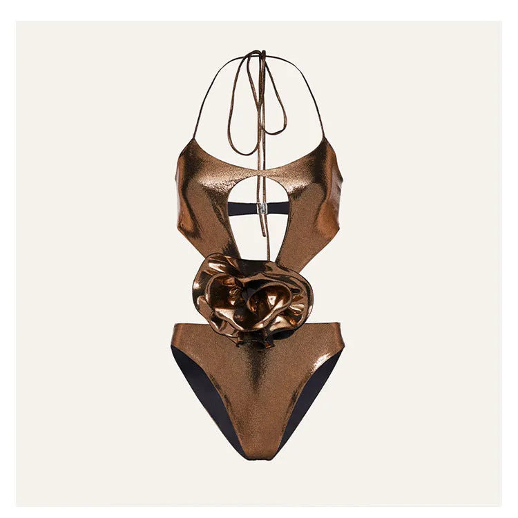 Gold coloured one-piece swimsuit with halter neckline on a model.