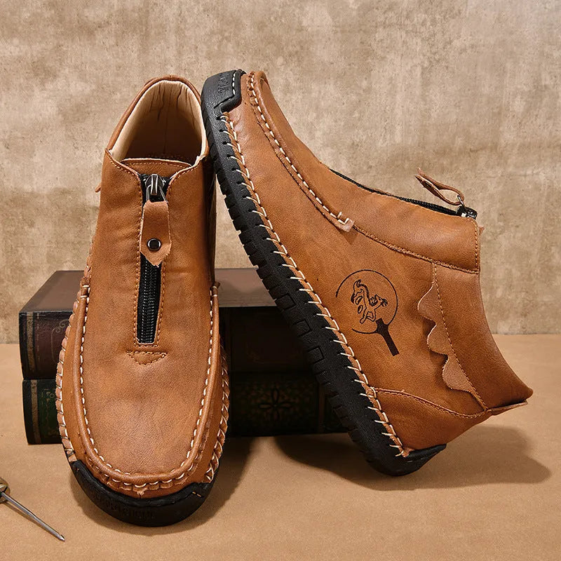 Men's slip-on leather loafers in black, brown, and grey colours showing round toe and rubber sole