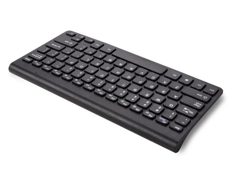 Black and white wireless keyboard and mouse set with USB receiver on a desk.