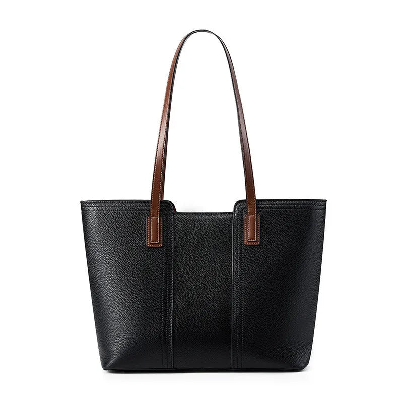 Women's black horizontal square leather commuter shoulder bag with crossbody strap and internal organiser pockets.