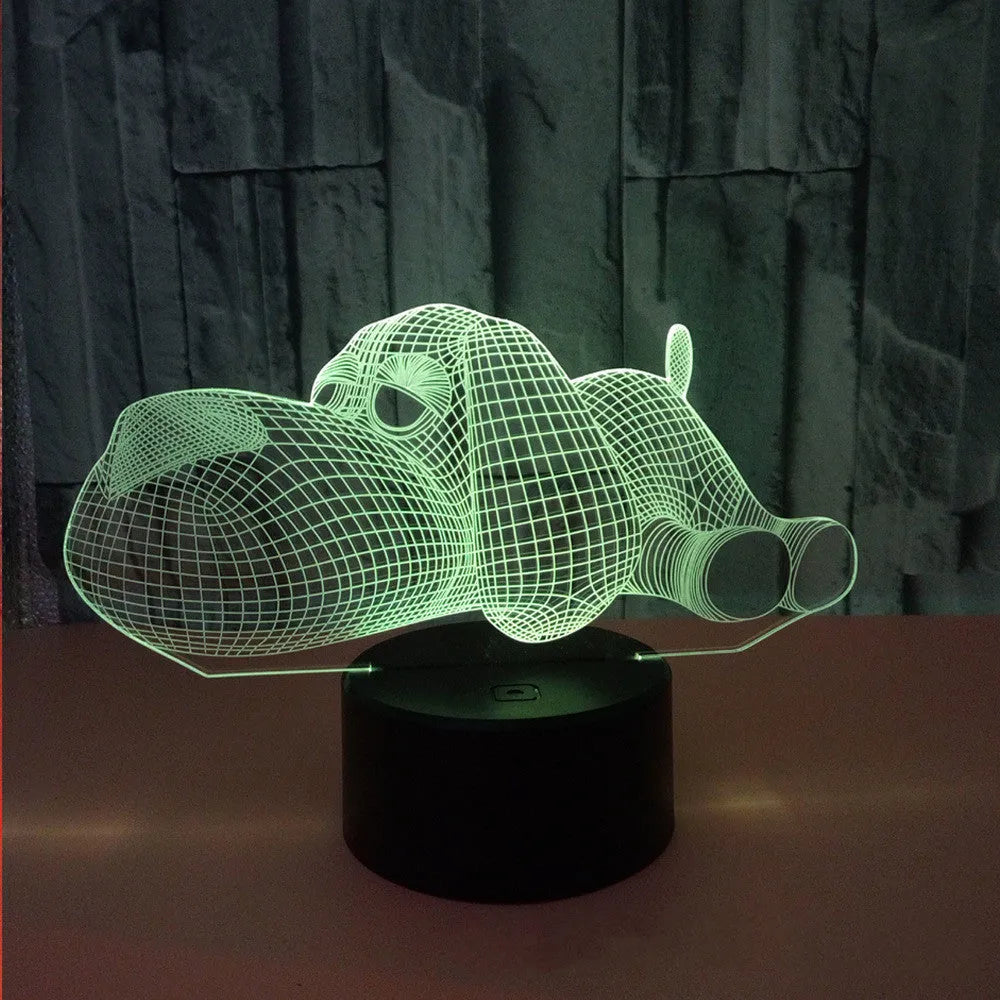 3D illusion dog lamp glowing with multi-colour light on a desk base