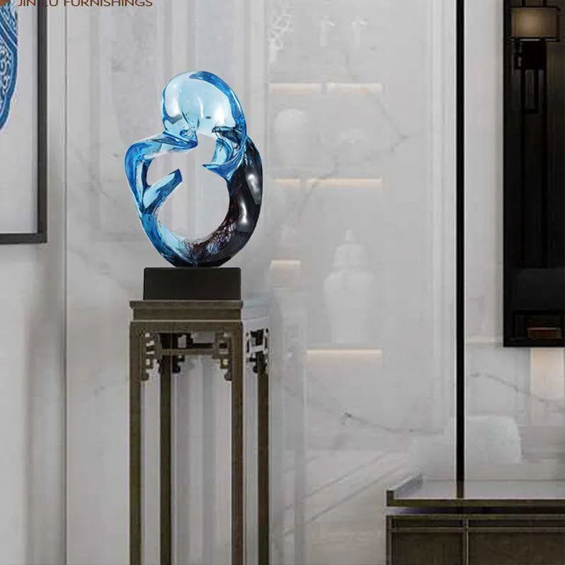 Transparent resin craft ornament in modern simplicity style on a shelf, shown in blue and orange red colour options.
