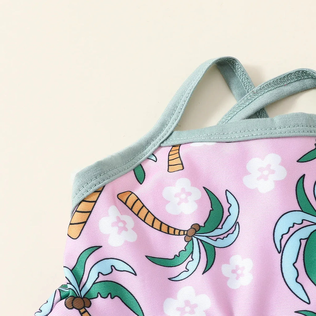 A white kids' two-piece swimsuit set consisting of a shirt and shorts, laid flat.