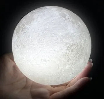 3D printed spherical moon lamp on a wooden stand with touch ring control
