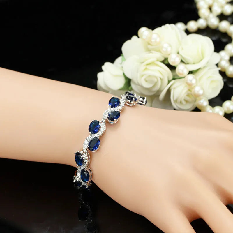 Copper-plated gold bracelet with zircon stones showing 18.4cm length and geometry design