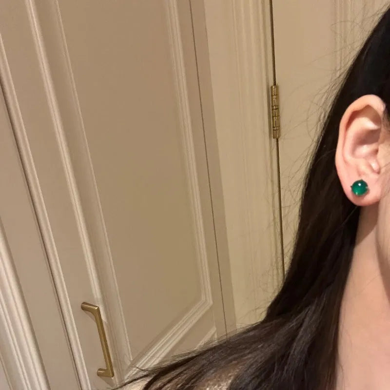 Chinese retro style chalcedony stud earrings with geometric round egg surface and four-claw stone setting