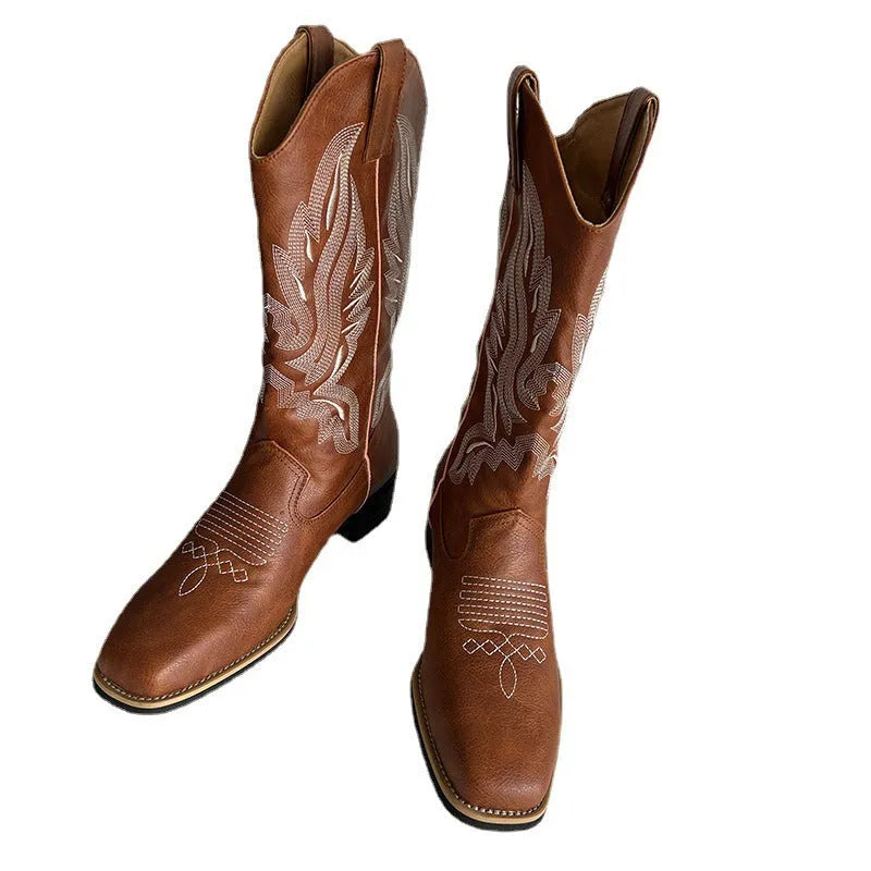 Brown women's embroidered mid-calf Martin boots with a round toe and low square heel.
