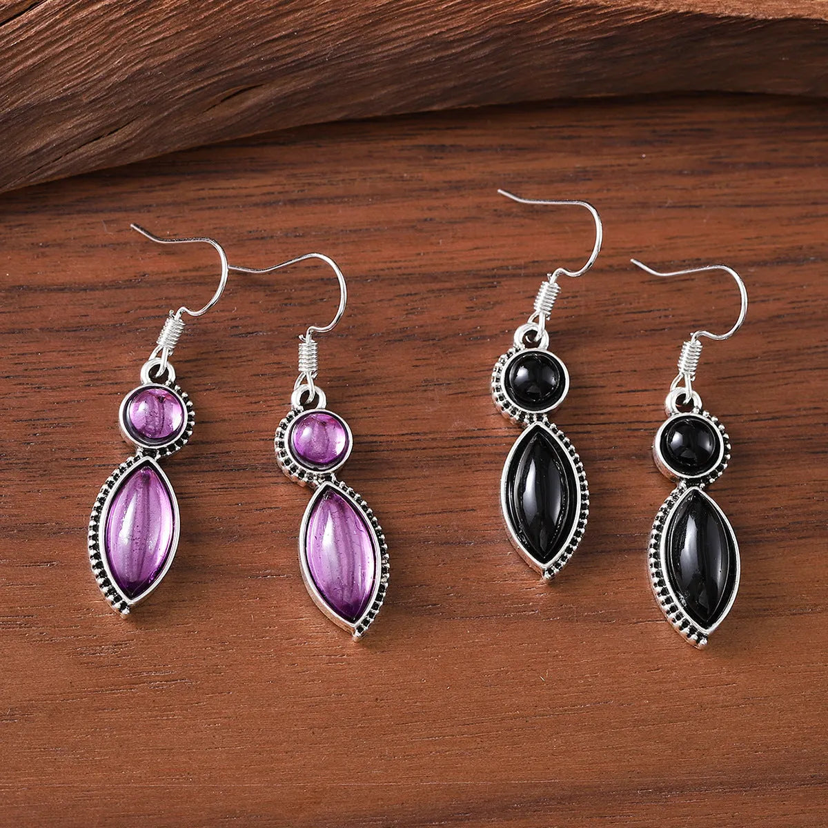 A pair of black and purple geometric vintage pendant earrings with a round detail, made from zinc alloy.