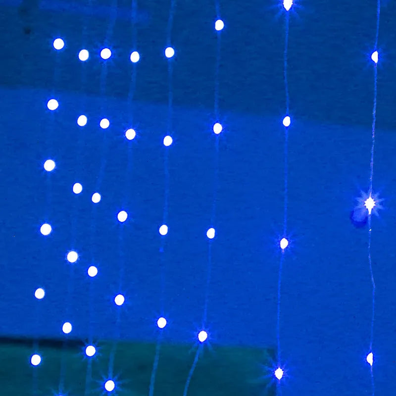 Copper curtain style USB-powered LED string lights in blue, draped decoratively.