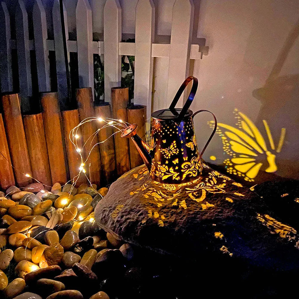 Iron solar garden lamp with tapered butterfly pattern and warm white LED lighting