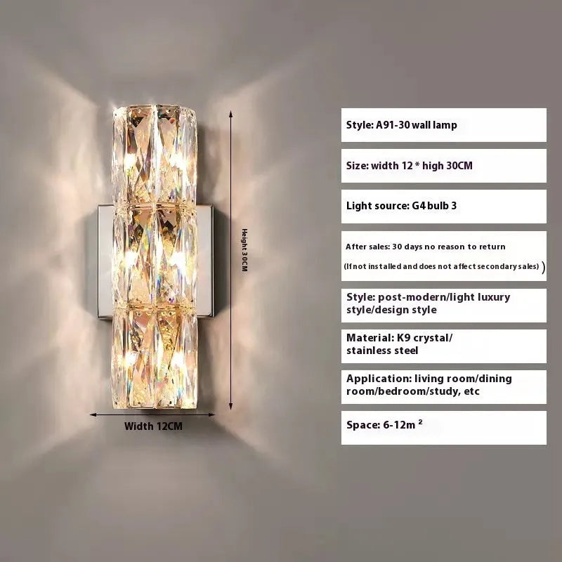Slim crystal and stainless steel wall lamp with LED light on a wall.