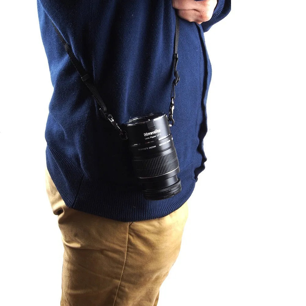 Aluminium alloy Nikon camera lens flipper dual holder with stainless steel buckle and cotton strap.