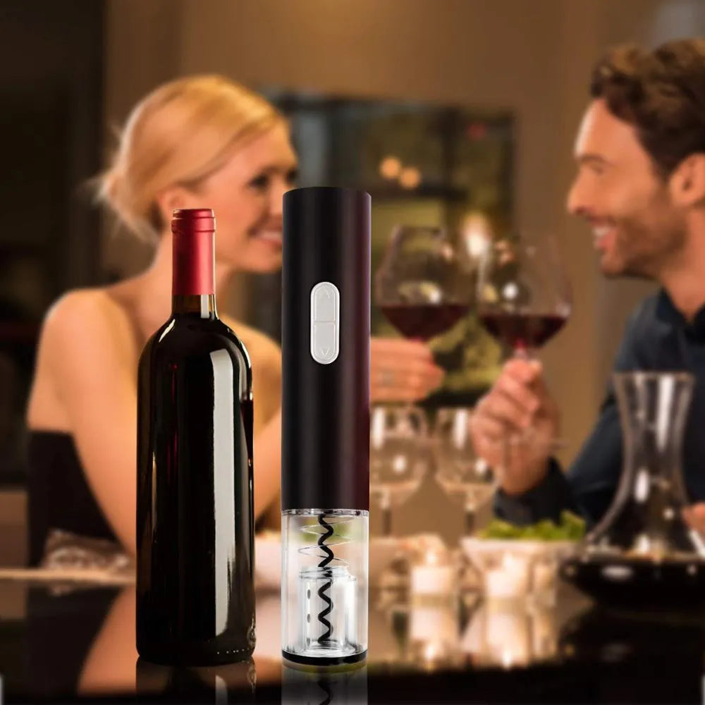 Black, red, and white electric wine bottle opener with foil cutter on a kitchen counter
