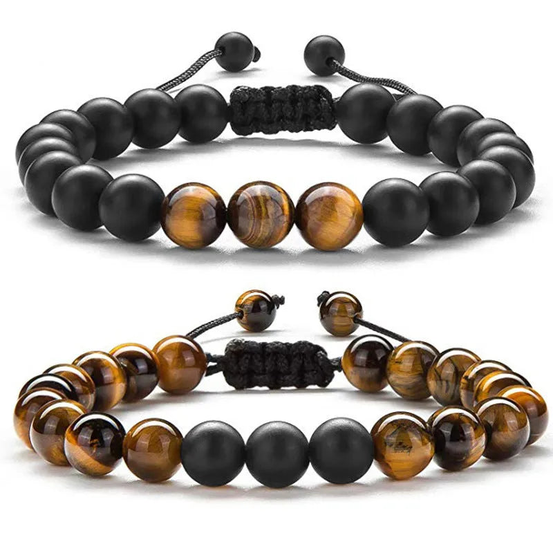 A pair of matte black agate bead bracelets with geometric design for him and her.