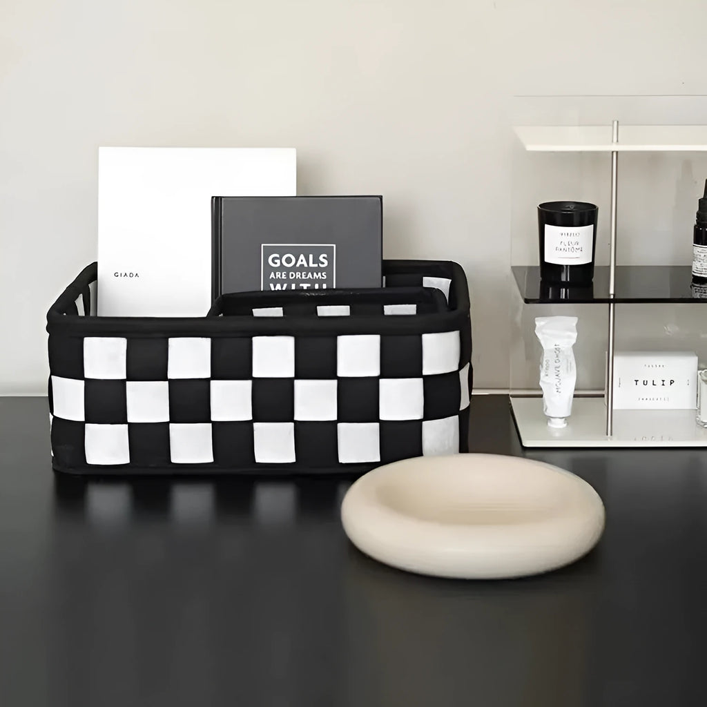 Grey and white checkerboard woven folding felt storage basket showing collapsible design