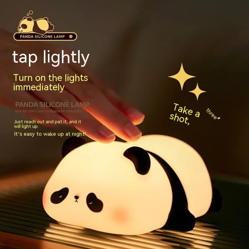 Cartoon panda-shaped night light with soft silicone construction and warm white LED glow