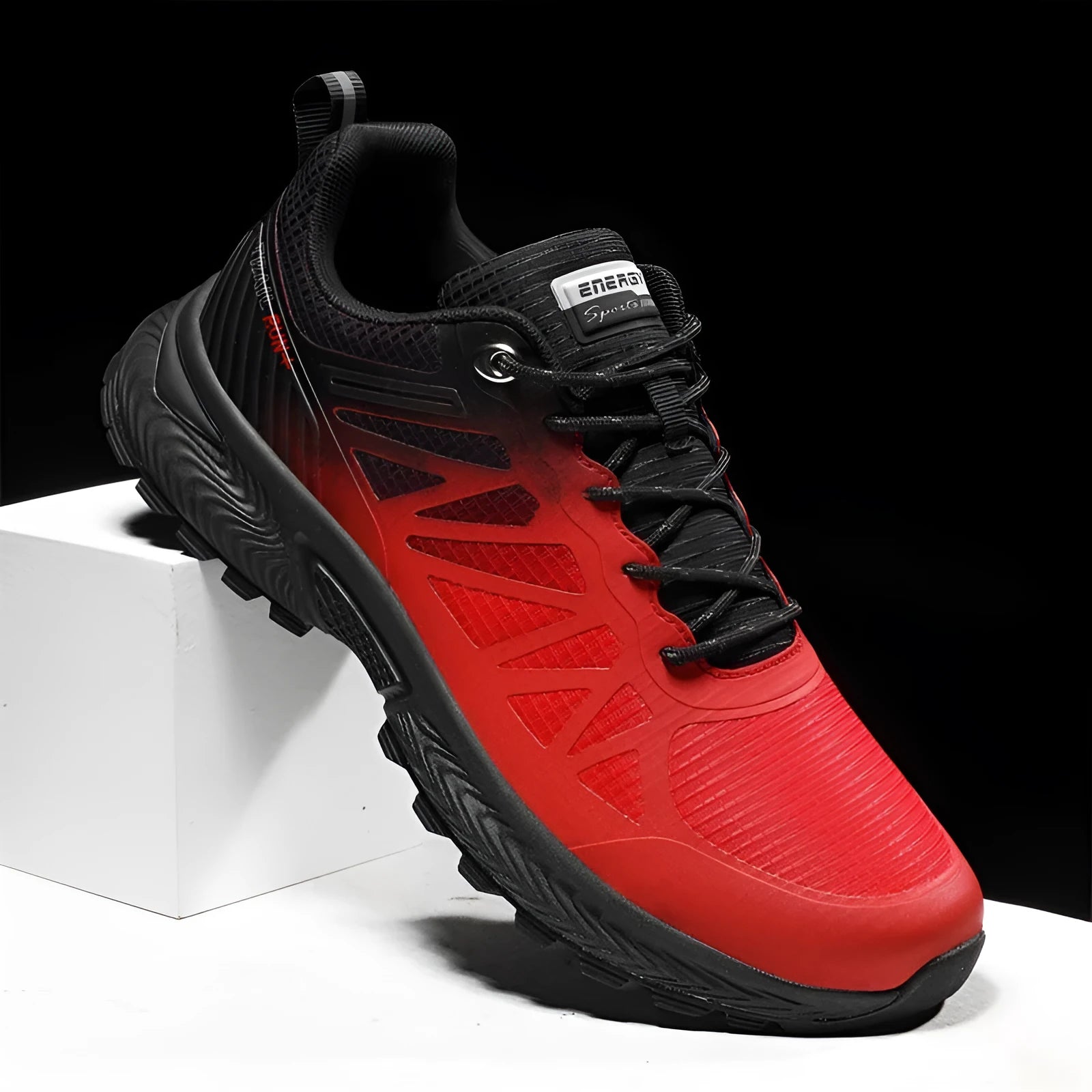 Men's black and orange mesh running shoe with lace-up front and rubber sole.