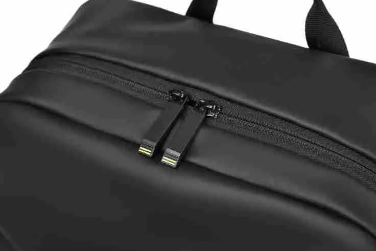 Waterproof black PU leather backpack with sewing thread details and large capacity storage