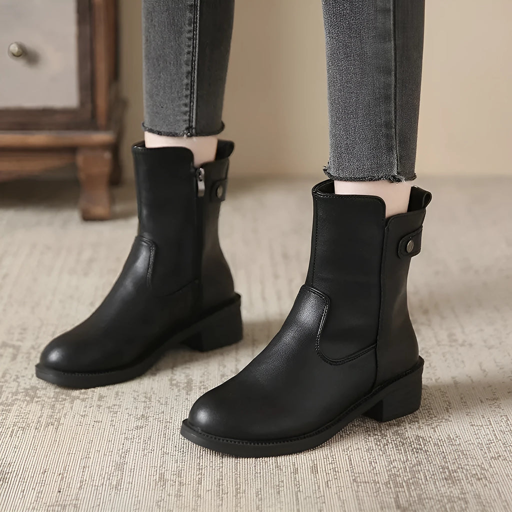 Black women's ankle boots with side zip and a low round toe.