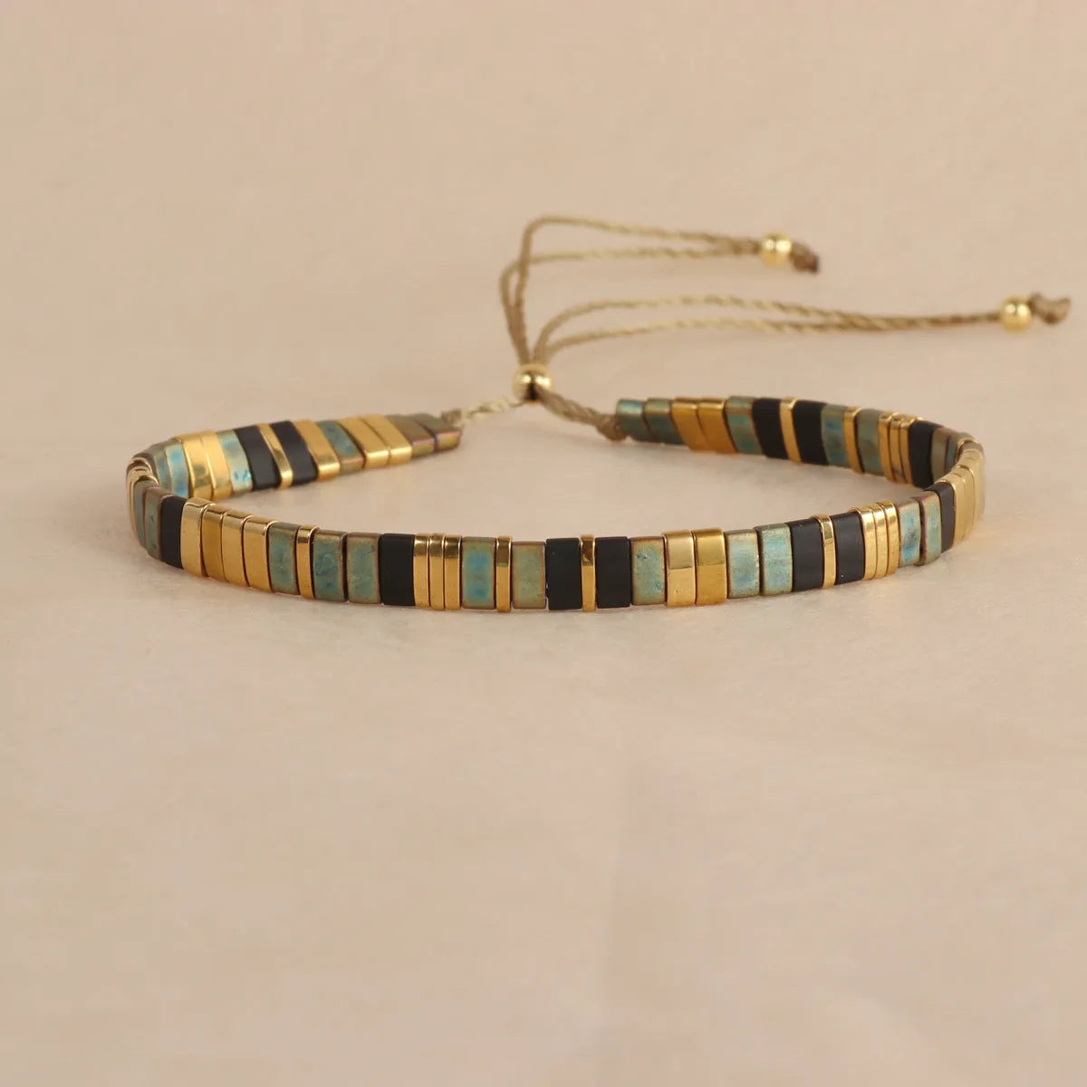 Geometric glass pull bead bracelet in five colour options on wrist
