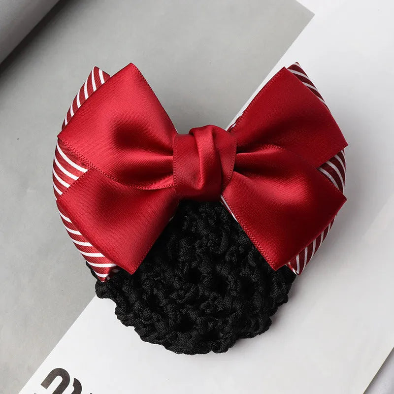 Professional flower bow headdress hair clip ornament on a work plate, shown in a selection of net and mesh colour variations.