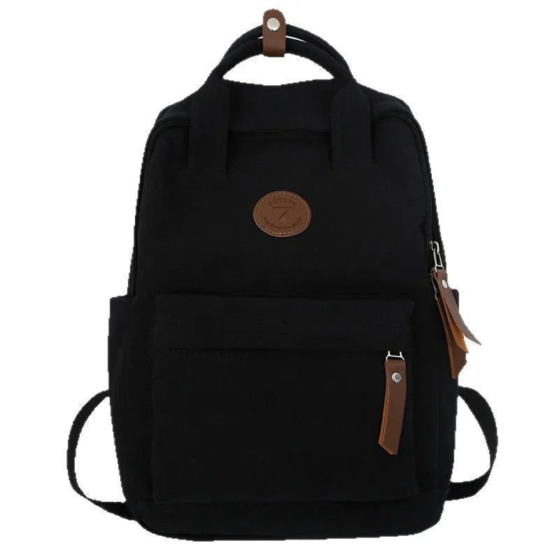 Black Oxford cloth unisex backpack with curved shoulder straps and retro sewing thread detailing