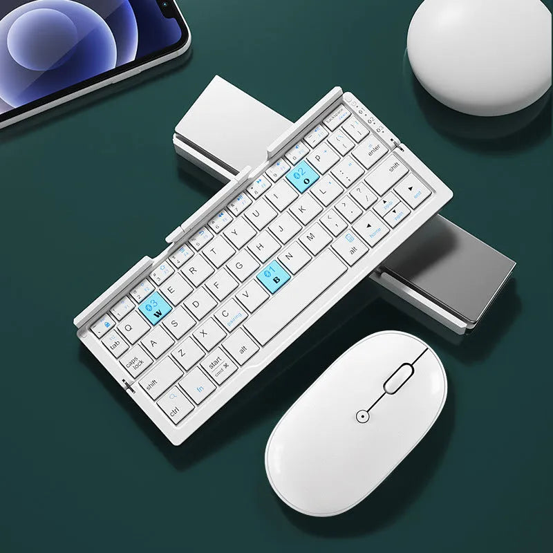 Silver white aluminium folding Bluetooth keyboard open with smartphone propped on hidden stand