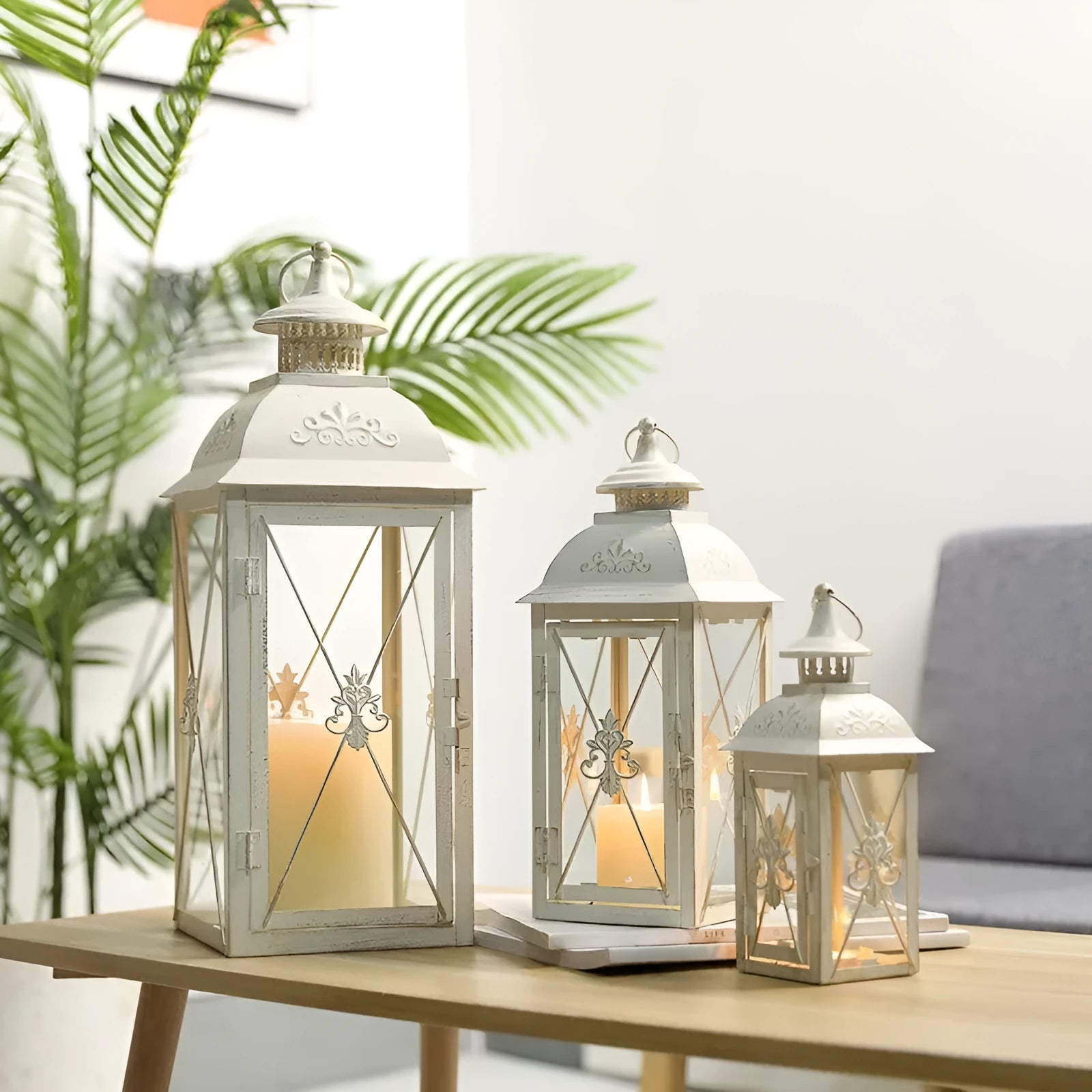 Black and white wrought iron floor-standing storm lantern with tempered glass panels for courtyard use