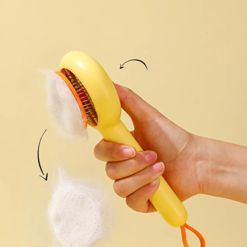 Small yellow duck-shaped pet grooming comb with open section design and needle pins for hair removal