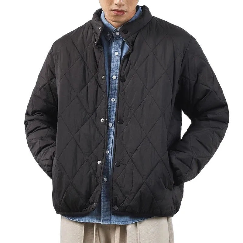 Men's black extended length winter jacket showing loose fit and urban style design