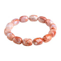 Natural cherry agate bracelet with barrel-shaped beads showing Ruyi geometric design