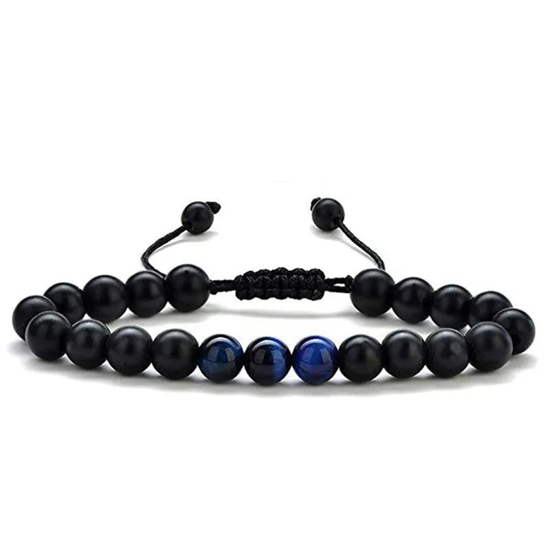 A pair of matte black agate bead bracelets with geometric design for him and her.