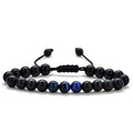 A pair of matte black agate bead bracelets with geometric design for him and her.