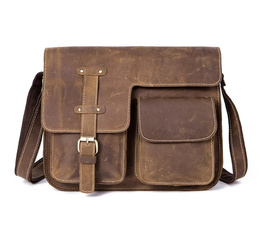Brown leather vintage messenger bag with flap closure, antique buckle, and adjustable crossbody strap.