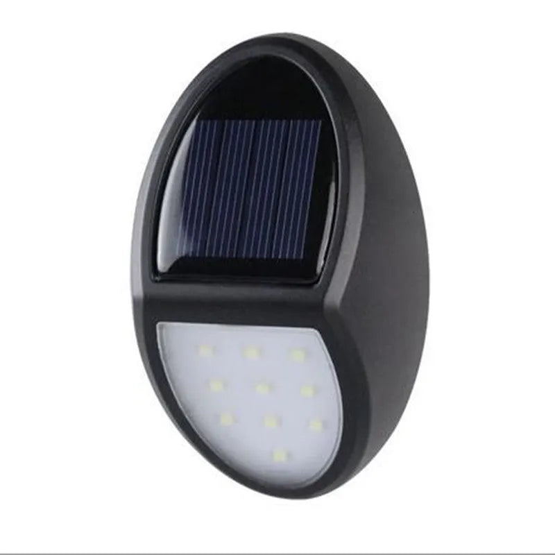 Black rectangular solar-powered LED wall light with automatic sensor for outdoor use.