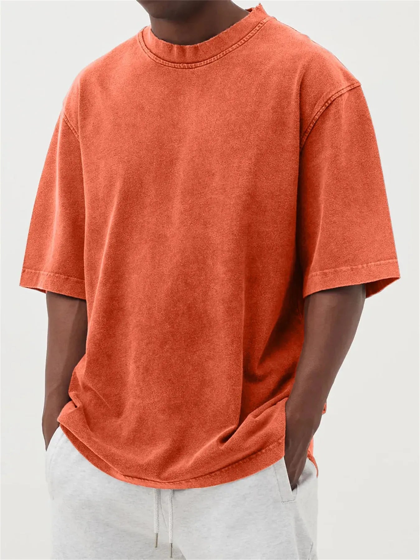 Men's loose fit distressed pullover t-shirt in stone washed polyester showing half sleeve design