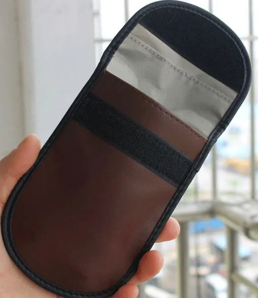 Black microfiber RFID blocking bag for mobile phones and credit cards, measuring 13.5 by 9.5 cm.