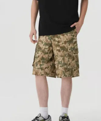 Men's loose-fit camouflage print shorts in retro workwear style on a white background.