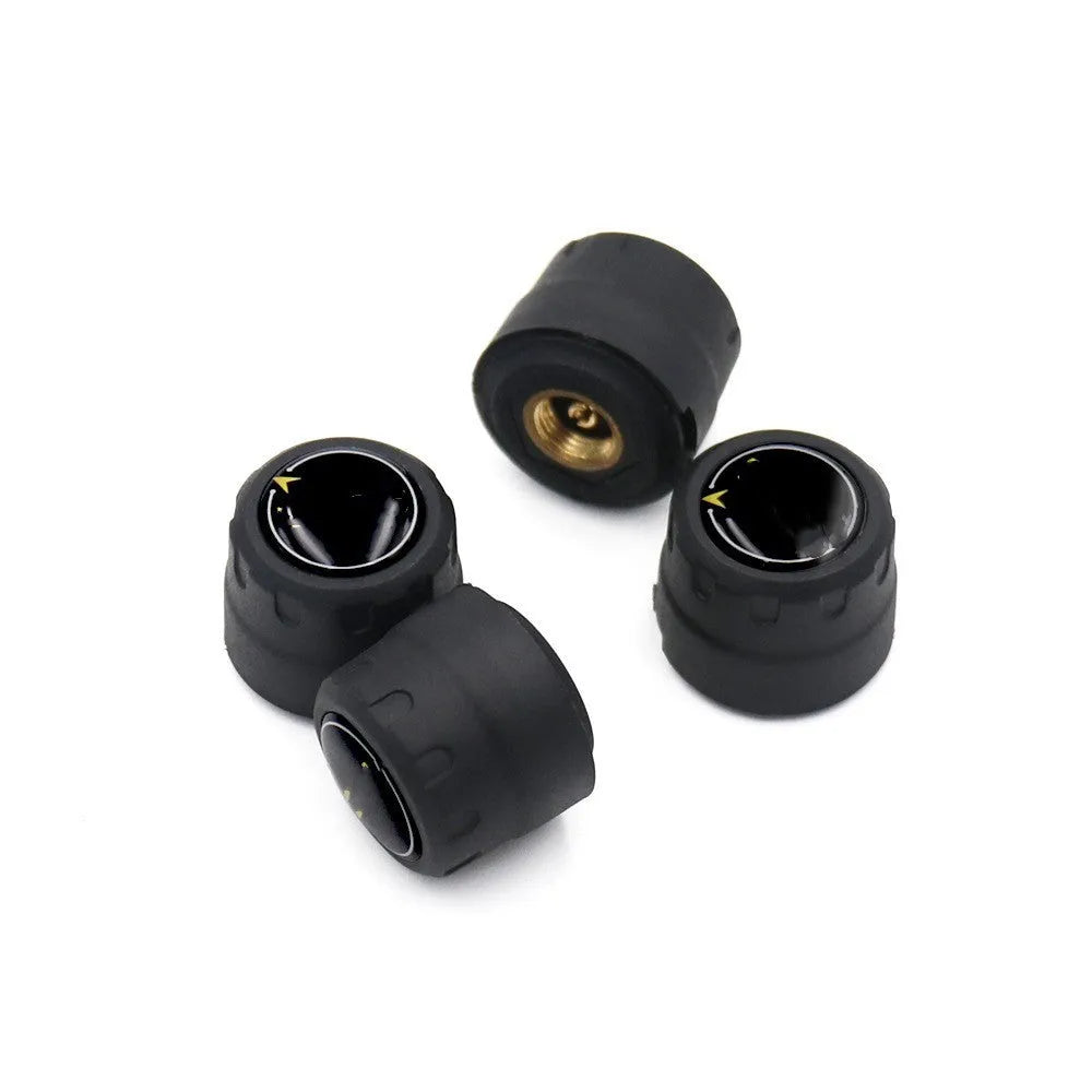 Black Bluetooth tyre pressure monitoring system kit with four external sensors, a wrench, and anti-theft screws on a white background