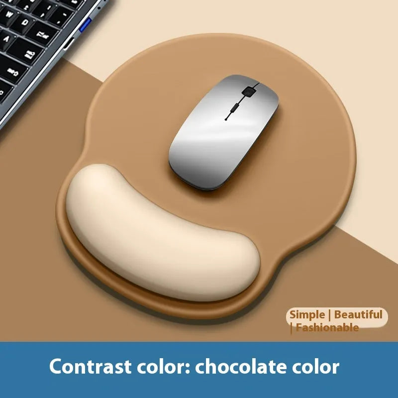 Silicone mouse mat with attached gel wrist support in a gradient blue colour on a desk.