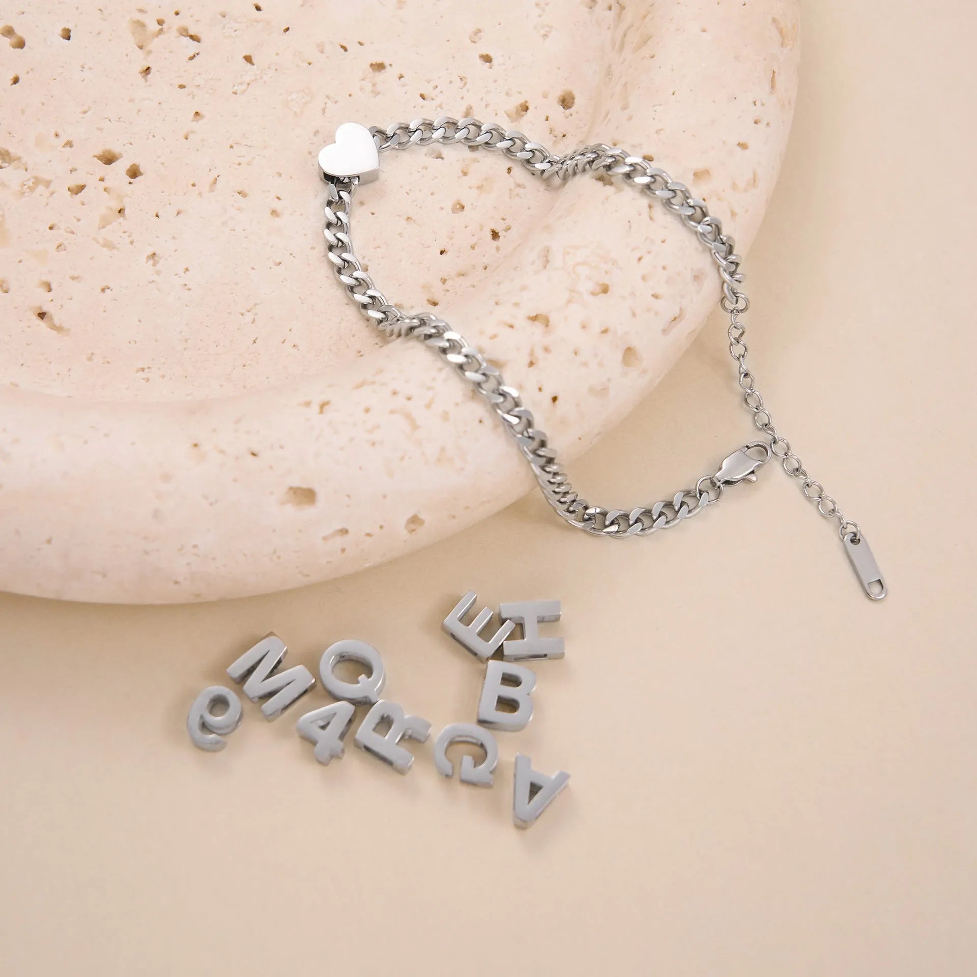 Gold titanium steel necklace with a letter A charm on a 40.5cm chain.
